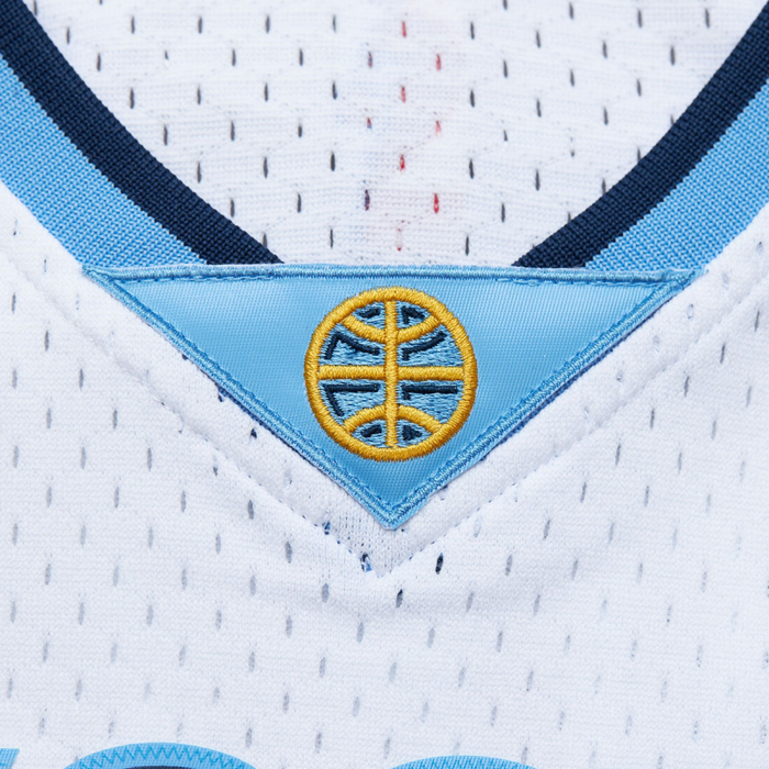 Up close view of front White basketball jersey neckline with light blue triangle with Yellow basketball logo