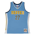 Front view light blue basketball jersey with Nuggets in yellow, navy trim and trimmed in white  and number '27' in navy with yellow outline on a white background