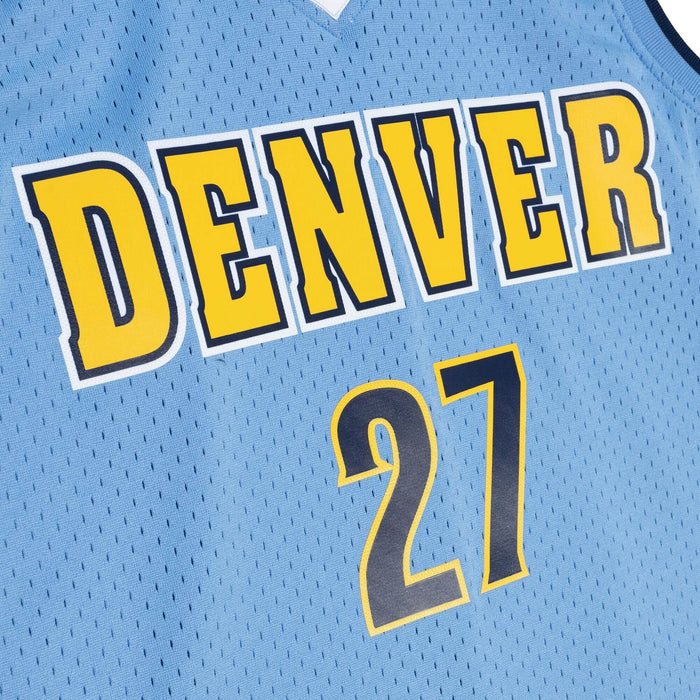 Up close Front view light blue basketball jersey with Nuggets in yellow, navy trim and trimmed in white  and number '27' in navy with yellow outline on a white background