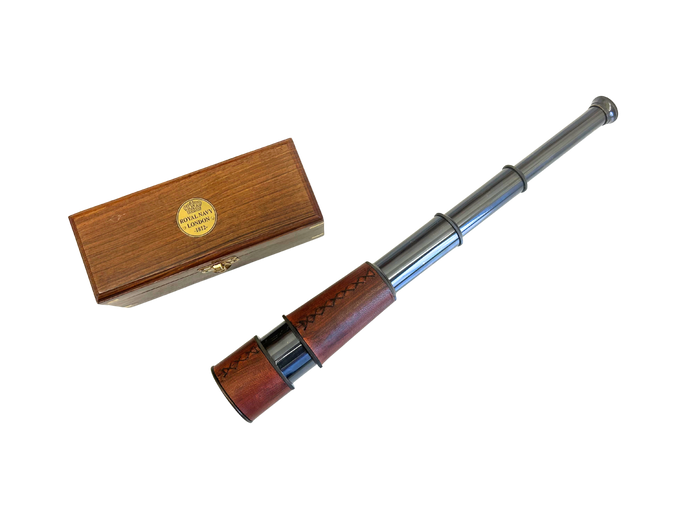 Metal spyglass with metal accents and a wooden case on a white background