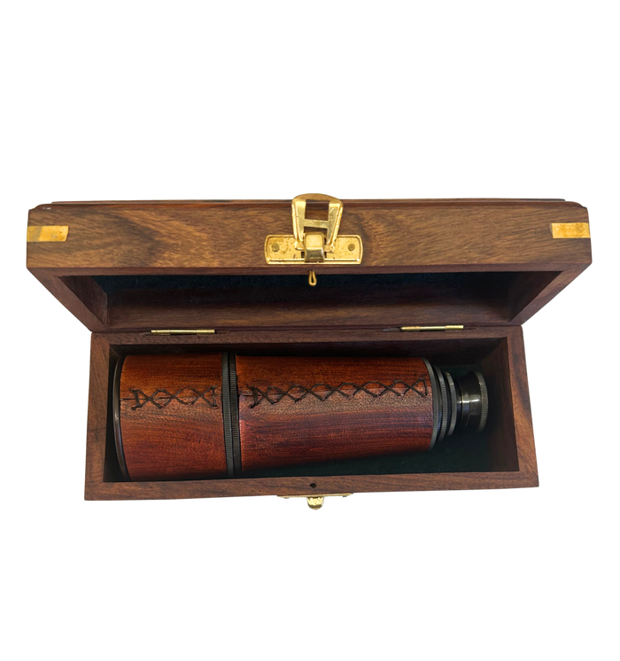 Wooden box with a lid open, revealing spyglass inside.