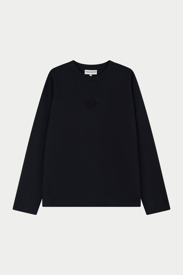 Black long-sleeve shirt on a light grey background