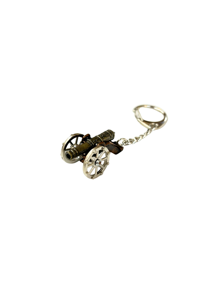 Keychain shaped like a small cannon on a white background