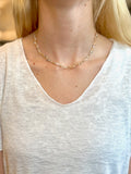 Necklace worn by a person with a neutral background