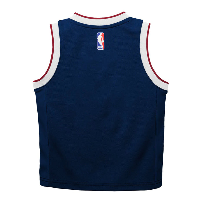 Back view of a navy blue Denver Nuggets basketball jersey with the NBA logoman just below the neckline   and a white and red trim around the neckline and armholes.