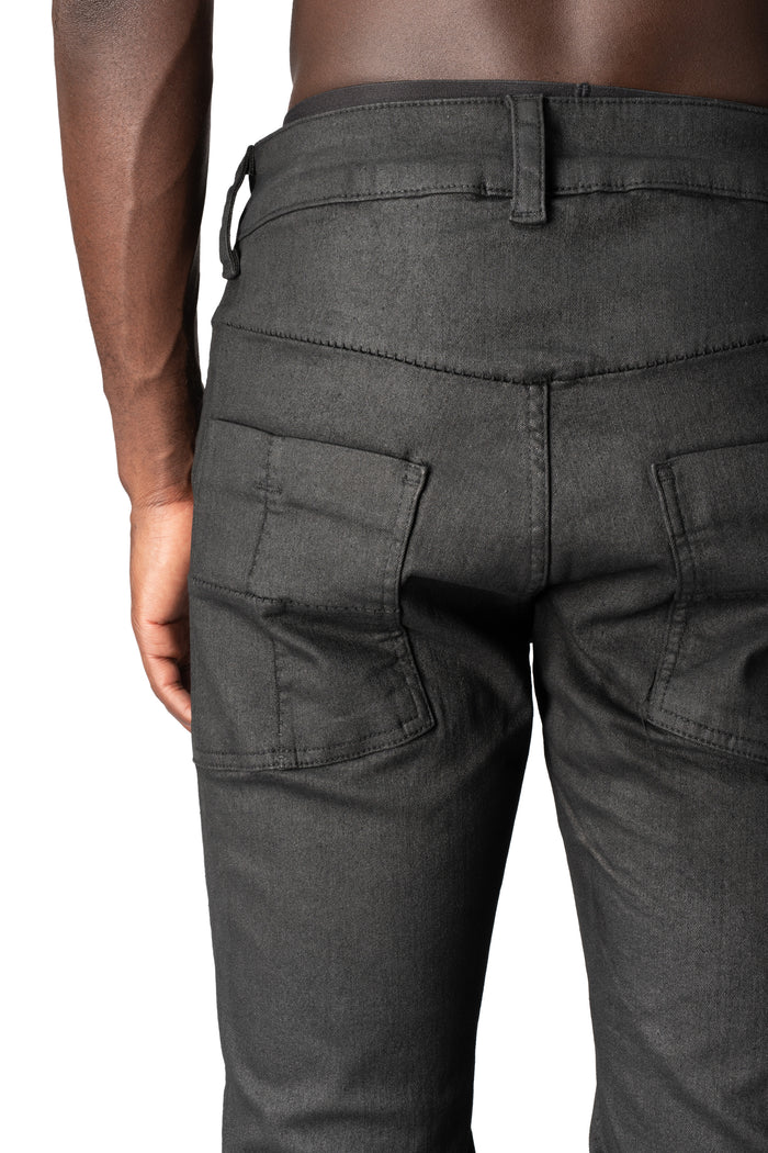 Coated stretch denim trousers