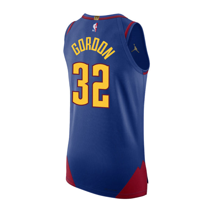 Back view Royal Blue basketball jersey with 'Gordon' in yellow and number '32' in white with red outline on a white background