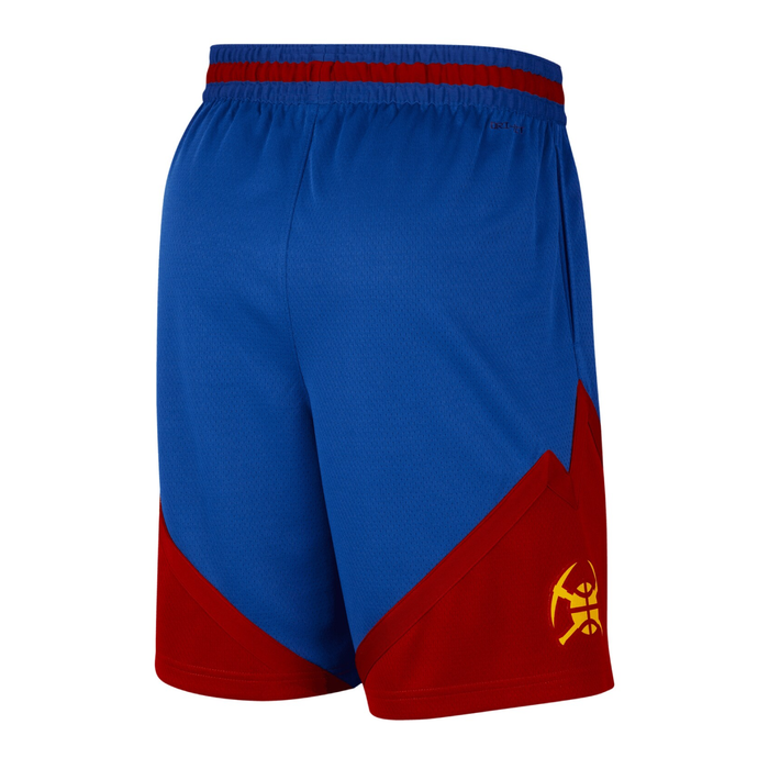 Right side profile view of the royal blue and red Denver Nuggets shorts. The view matches the left side paneling, displaying a solid royal blue upper section that transitions into a jagged, dark red mountain peak design at the lower hem. A gold crossed-pickaxes logo sits centered within the red color-blocked area just above the hemline vent