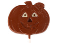 A cute smiling jack-o-lantern molded chocolate lollipop on a stick.