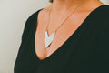 Brass Tulip Shield Necklace on model