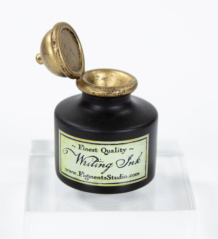 Close product shot of inkwell shaped pen holder