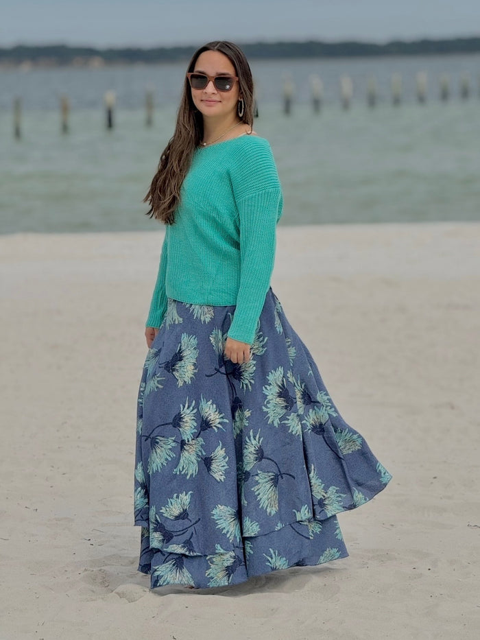 Model wearing Lily Sweater in Aqua styled with aqua blue floral wrap skirt and Shwood sunglasses