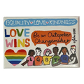 Magnet says Equality, Love , Kindness at top with colourful graphics