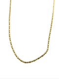 Gold chain necklace on a white background