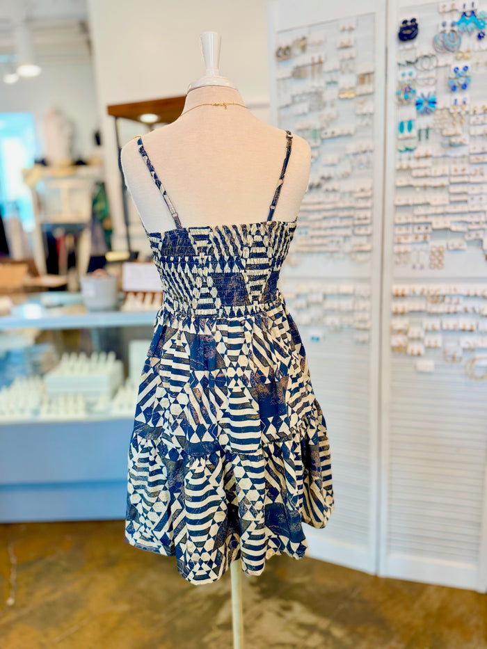 Back view of the Melissa Dress in Navy with adjustable straps and a relaxed, flowy fit.