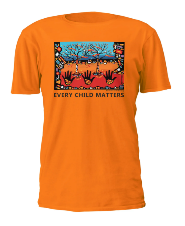 An orange short-sleeve crewneck t-shirt featuring a colorful graphic print on the chest with the text 'EVERY CHILD MATTERS' underneath, set against a plain white background.