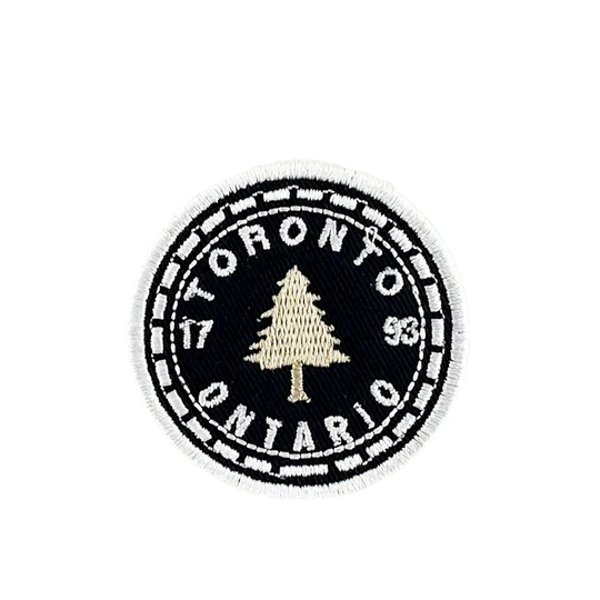 Round patch with 'Toronto, Ontario' text and a tree design on a white background