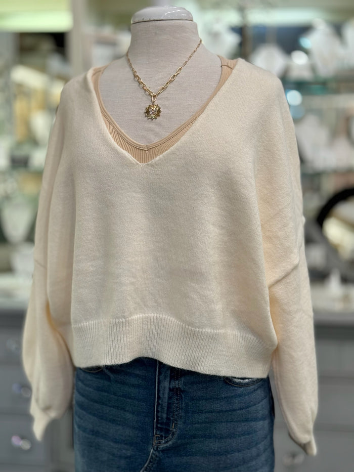 Front view of Ren Reversible Cropped Sweater in cream with V neckline.