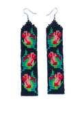 Close product shot of beaded earrings, each with 3 red and pink rosebuds on a black background.