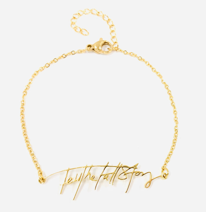 Gold plated bracelet with "Tell the Full Story" in custom handwriting