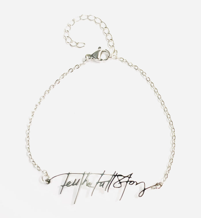 Stainless steel bracelet with "Tell the Full Story" in custom handwriting