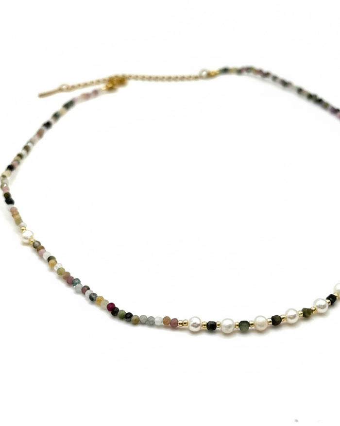 Necklace with small beads on a white background
