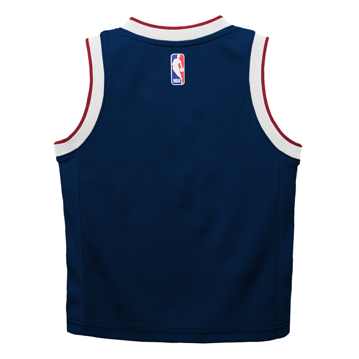 Back view of a blank youth navy blue Denver Nuggets jersey showcasing the NBA logo patch below the collar