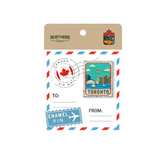 Enamel pin packaging with a Toronto-themed design on a white background