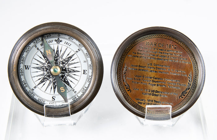 Close up view of compass face and inside of lid, engraved with War of 1812 information