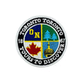 Circular patch with Toronto-themed design on a white background